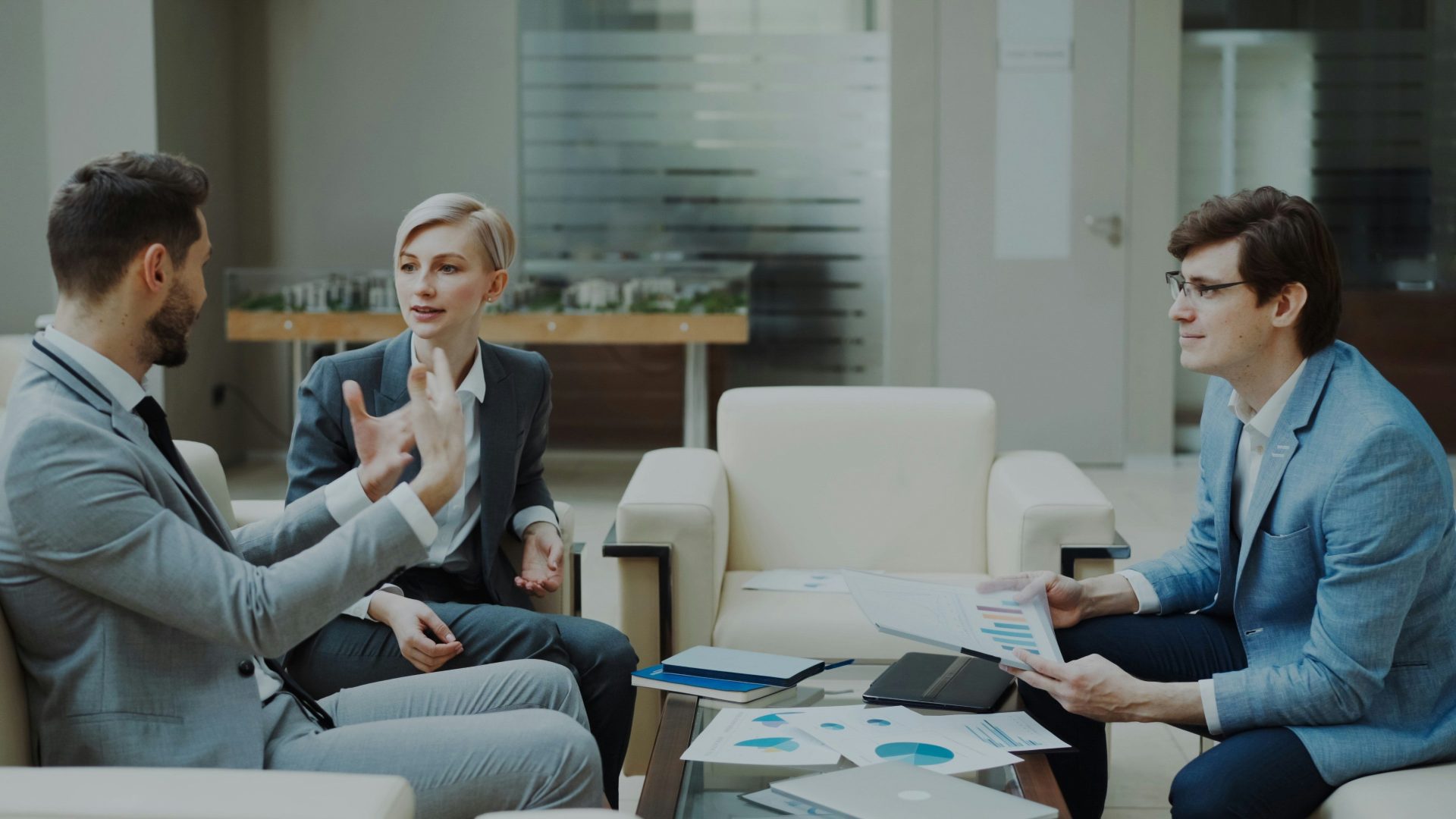 Three business people in a meeting